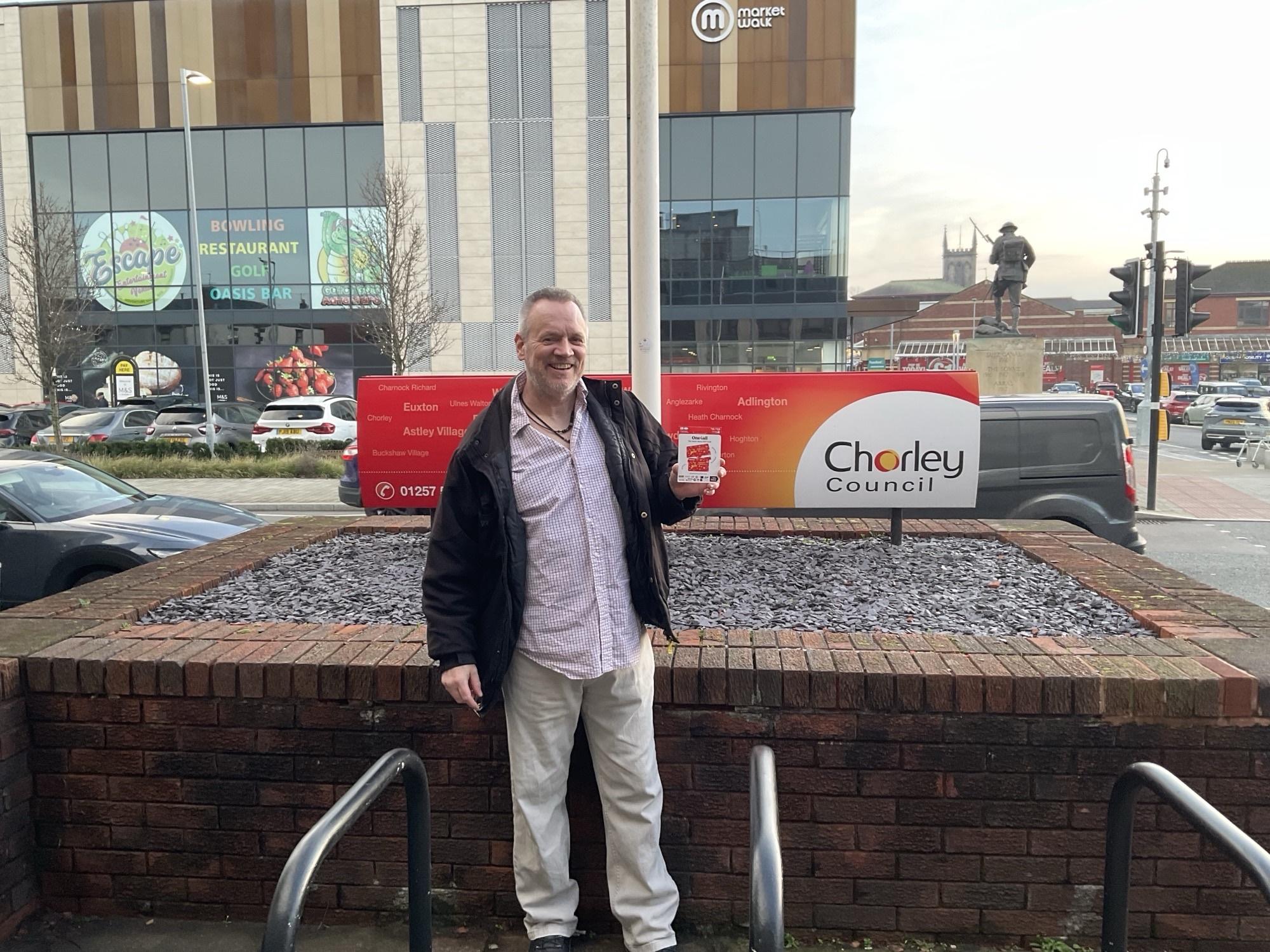 image of chorley winner with prize outside council offices