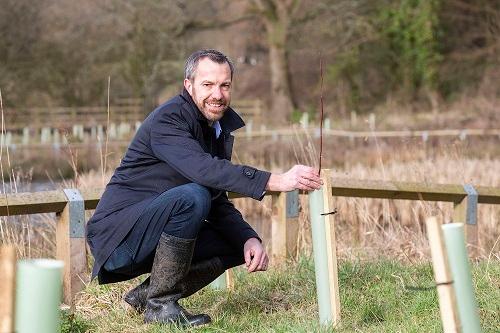 Councillor Alistair Bradley at Yarrow Meadows tree planting site